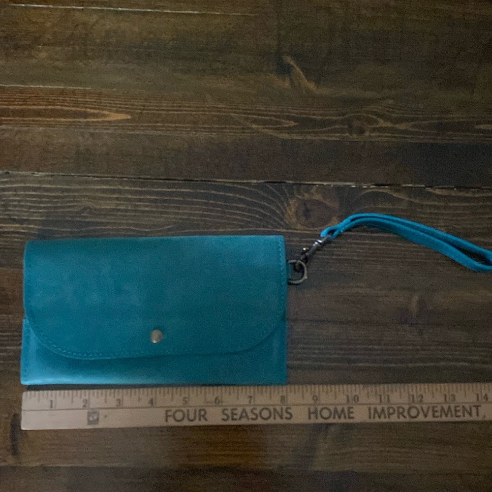 Able brand aqua blue leather wristlet with strap. Great condition